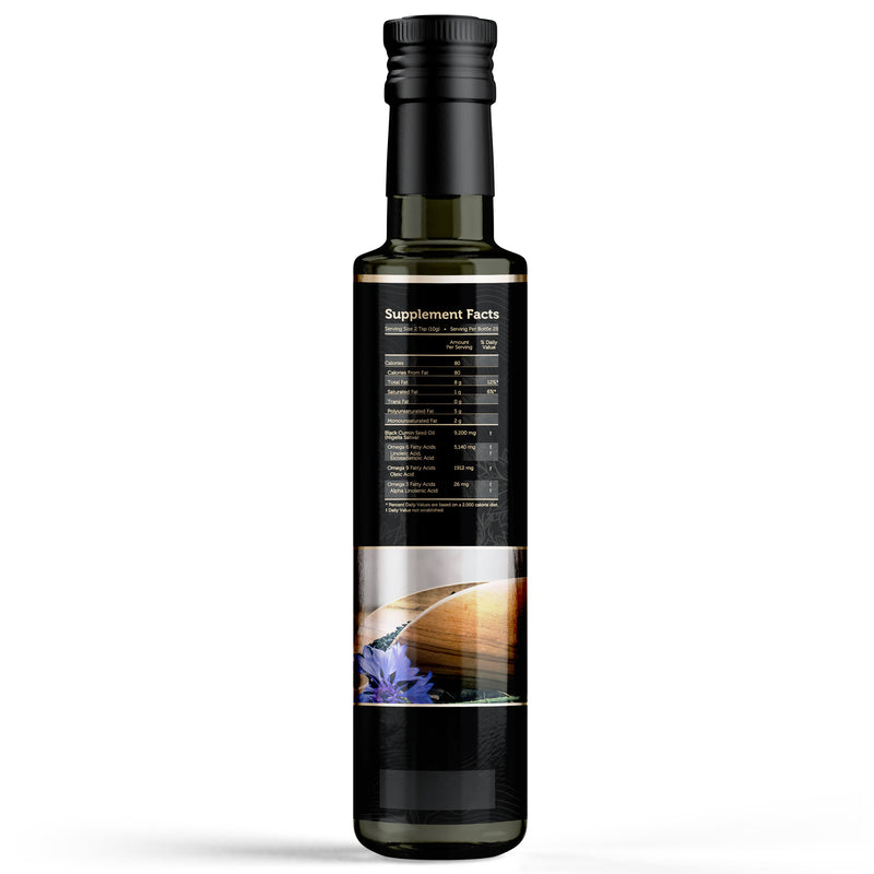 Volume black seed oil bottle on dark background